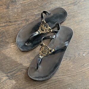 Michael Kors Black Jelly Thong Sandals with Gold MK Medallion